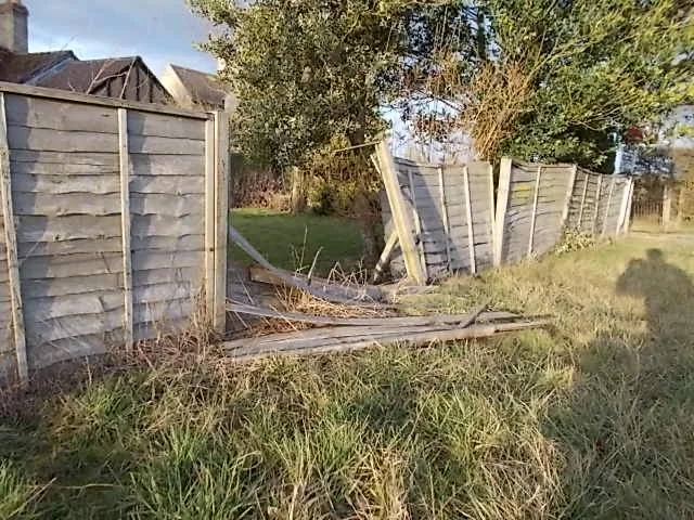 A fence panel collapsed after a storm